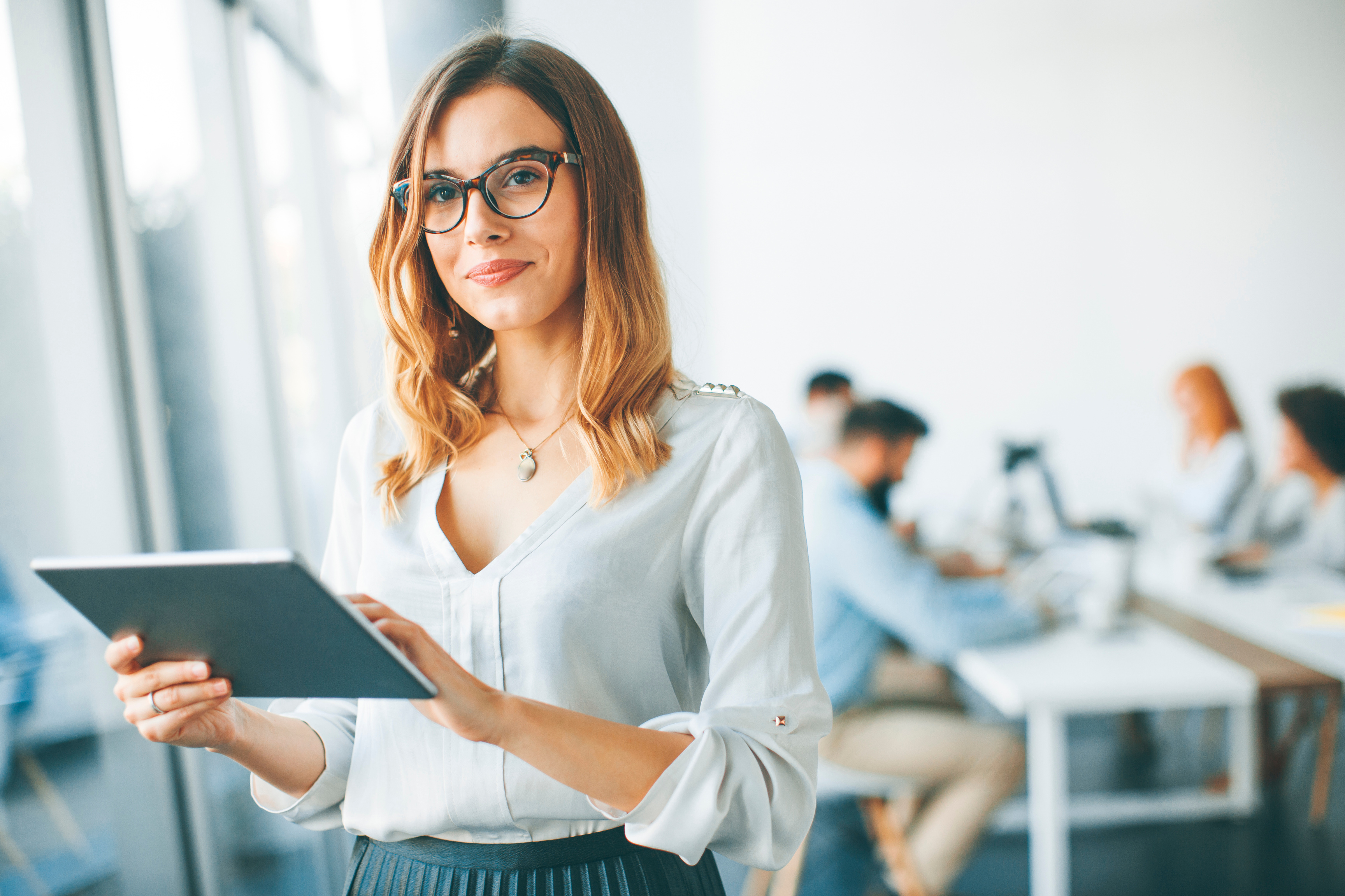 Portrait of an Employee Holding a Tablet 